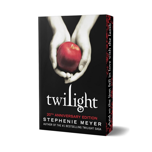 Book cover of 'Twilight' with hands holding an apple on a black background